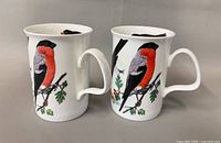 Two mugs showing bullfinch design