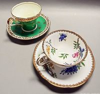 Both teacup and saucer sets side by side displaying patterns