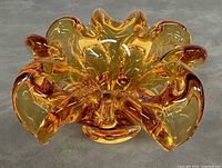 Top view showing full shape and ruffled rim of amber glass bowl