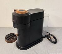 Front angled view showing full machine, water tank, power cord