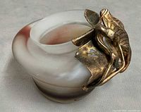 Top angled view showing glass coloration and metal overlay detail