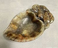 Top view showing overall leaf shape, carved overlap leaves, interior bowl