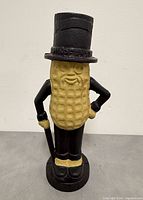 Front view of painted cast iron Mr. Peanut coin bank
