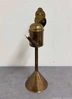 Full view of brass whale oil lamp front
