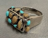 Oblique view showing bezel stones and band profile