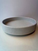 Top angled view of pale grey low bowl