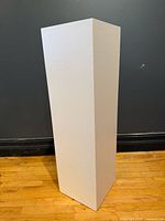 Full view of white display pedestal