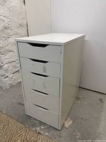 front view showing five drawers and recessed handles