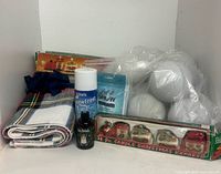 All items grouped in cabinet: runner, snowballs, train candles, SnowFrost spray, Glogg oil, napkins