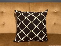 Front view of pillow on sofa showing full pattern and shape