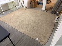 Full view of rectangular natural fiber rug on floor