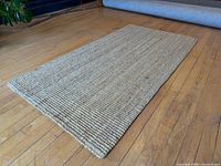 Full view of IKEA natural woven runner rug on floor