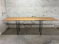 Full view of table front and top showing dimensions and leg style