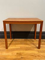 Front view of Danish teak side table