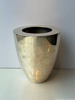 front view of silver-tone metal vase