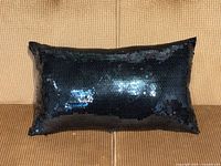 Front view showing navy blue sequins covering pillow