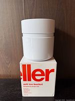 Ice bucket resting on original Heller box