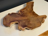 Top view of live edge wooden pedestal tray showing overall shape and grain