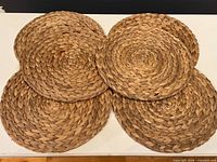 Six placemats displayed overlapping to show quantity and overall appearance