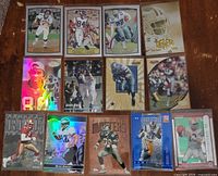Group shot of all 13 NFL trading cards