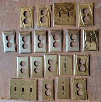 Front view of all 18 brass faceplates on board