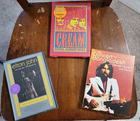 All three concert DVD cases on chair