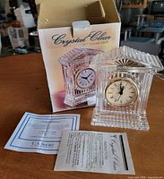 Clock with box and paperwork full view