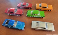 Top view of all six cars showing colour variety and general condition