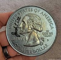 Obverse replicating U.S. quarter with Joseph L. Ertl signature visible
