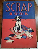 Front cover showing title SCRAP BOOK with dog illustration