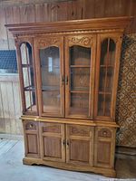 full view of wooden china cabinet showing hutch and buffet