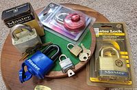 Group of six Master padlocks, two sealed, four loose with keys
