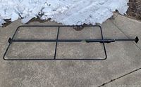 Full view of Milwaukee steel load lock bar with hoop frame on pavement