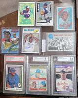 Group shot showing all nine cards in protective holders