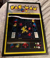 Front view of framed Pac-Man lenticular artwork