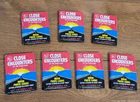 Seven sealed 1978 Topps Close Encounters wax packs front view