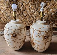 two matching ceramic floral table lamps with bulbs installed
