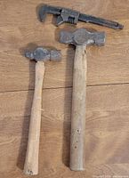 Two ball peen hammers and Ford wrench full view