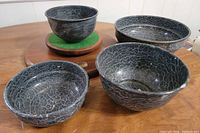 All four cloudy gray enamel bowls displayed