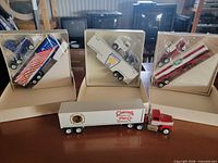 Group of four Winross trucks, three boxed, one loose