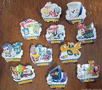 Group shot of all eleven eBay and PayPal enamel pins