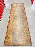 Full view of the distressed faux leather runner rug