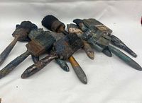 Group of ten antique paint brushes, wood handles, metal ferrules, paint-splattered