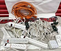 Group view of power strips, cords, adapters