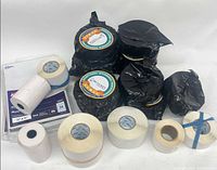 Group shot with Avery packs, sealed black-wrapped rolls and loose white rolls
