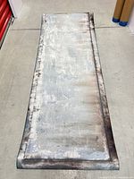 Unrolled sheet showing full rusted metal pattern