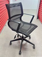 Full view of black mesh office chair