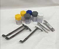 Group shot of all items: 3 wick trimmers, 6 taper shavers, 2 snuffers