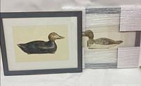 Both framed duck decoy prints, one unwrapped, one wrapped