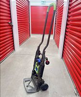 Hand truck in upright position showing full frame and handle